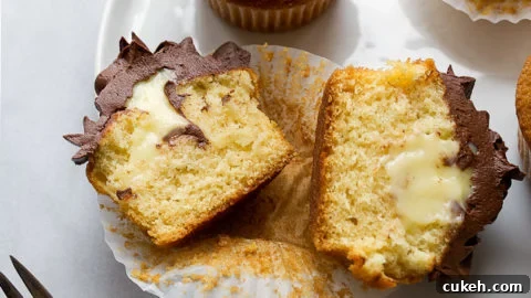Pastry cream filled cupcakes with chocolate ganache frosting