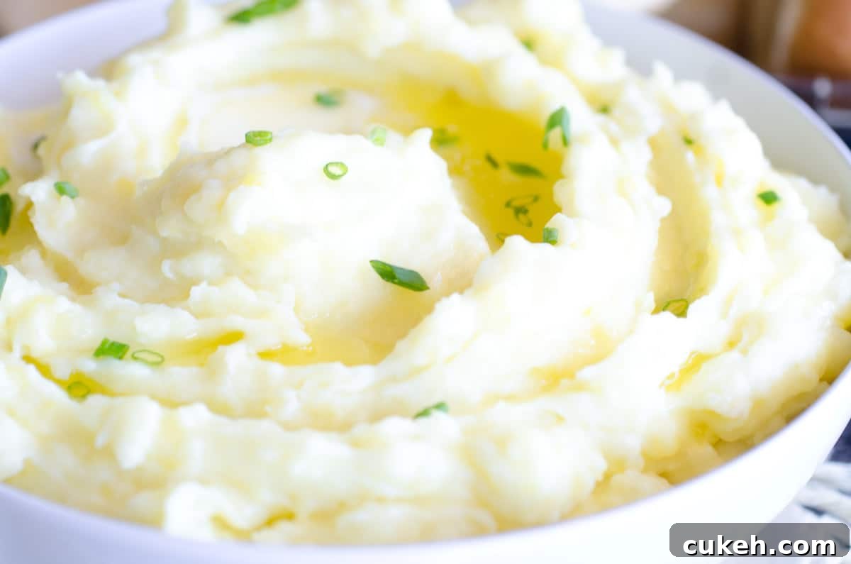 bowl of buttery mashed potatoes with chives
