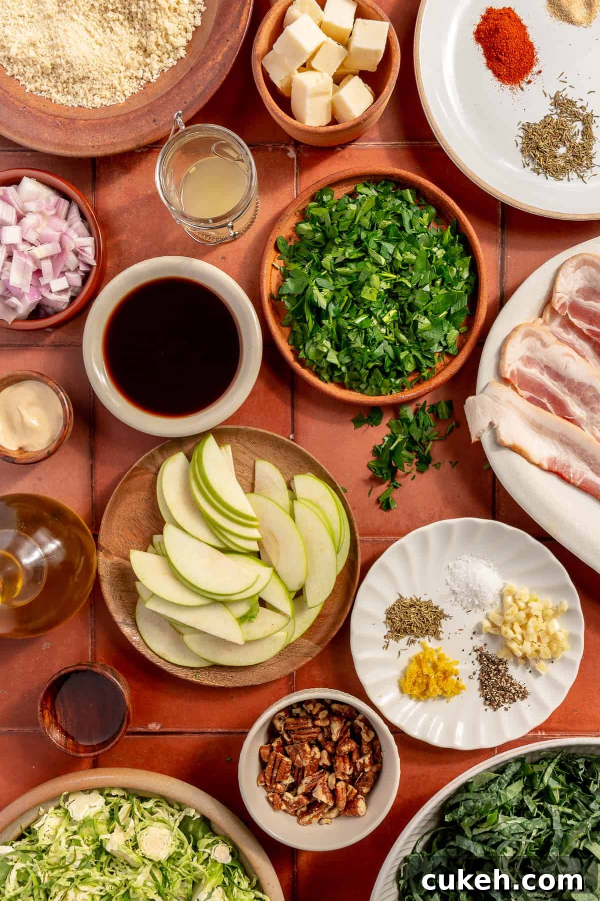 Bacon Brussels Crunch Salad ingredients scattered on tiled surface.