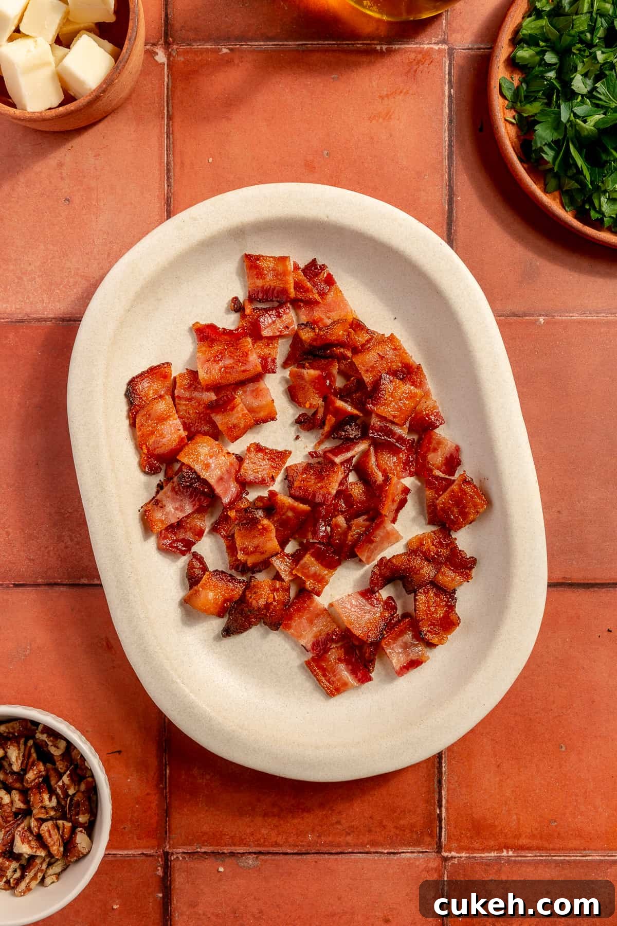 Chopped bacon on small plate.