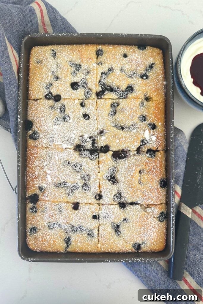 A tray of sourdough discard sheet pan pancakes studded with blueberries.