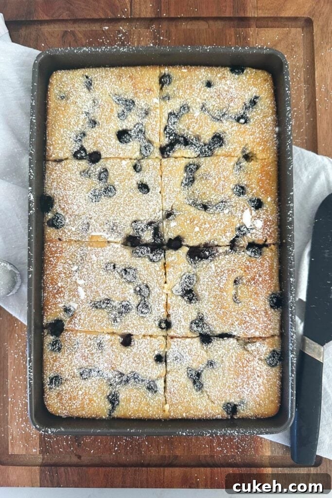 A sheet pan filled with blueberry baked sourdough discard pancakes.
