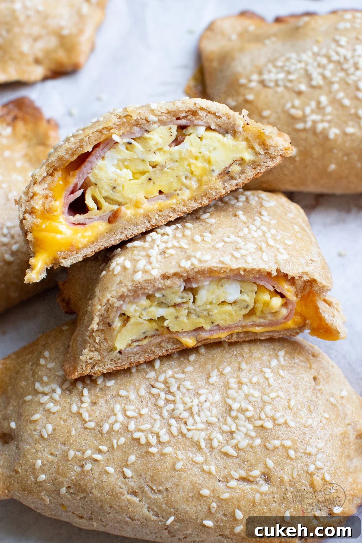 Feel good about Breakfast Hot Pockets made with freshly milled flour! These hot pockets are stuffed with eggs, bacon, ham, and cheese all wrapped inside a homemade flaky crescent roll crust. whole wheat breakfast hot pockets