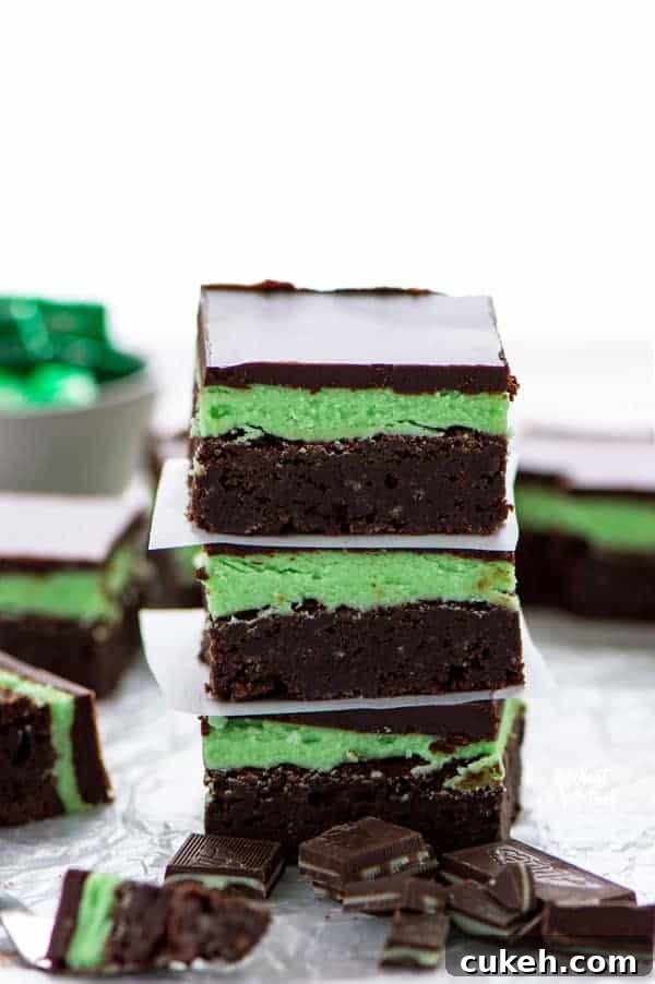 Mint Flourless Brownies topped with mint buttercream and chocolate ganache