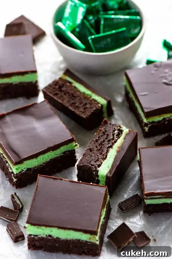 Mint Flourless Brownies topped with mint buttercream and chocolate ganache