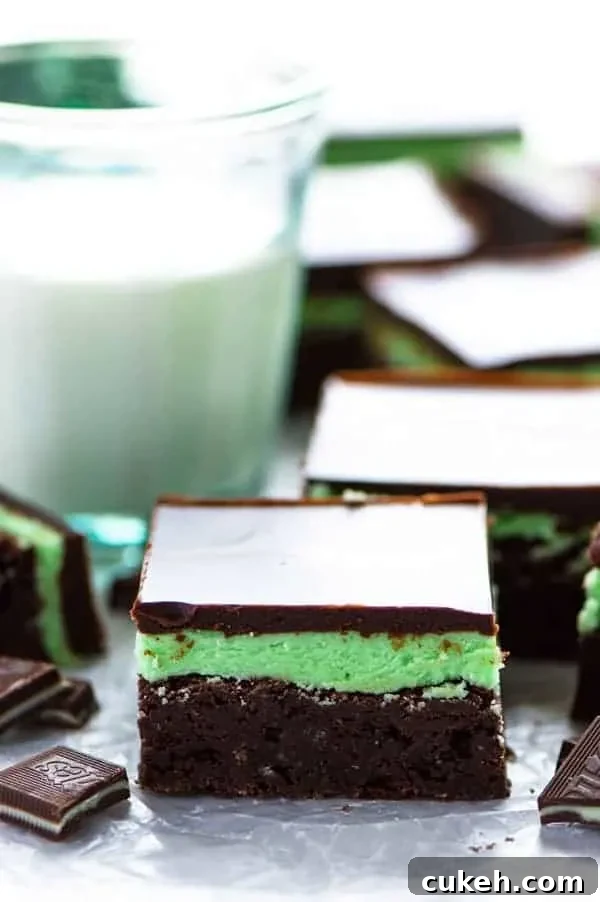 Mint Flourless Brownies topped with mint buttercream and chocolate ganache