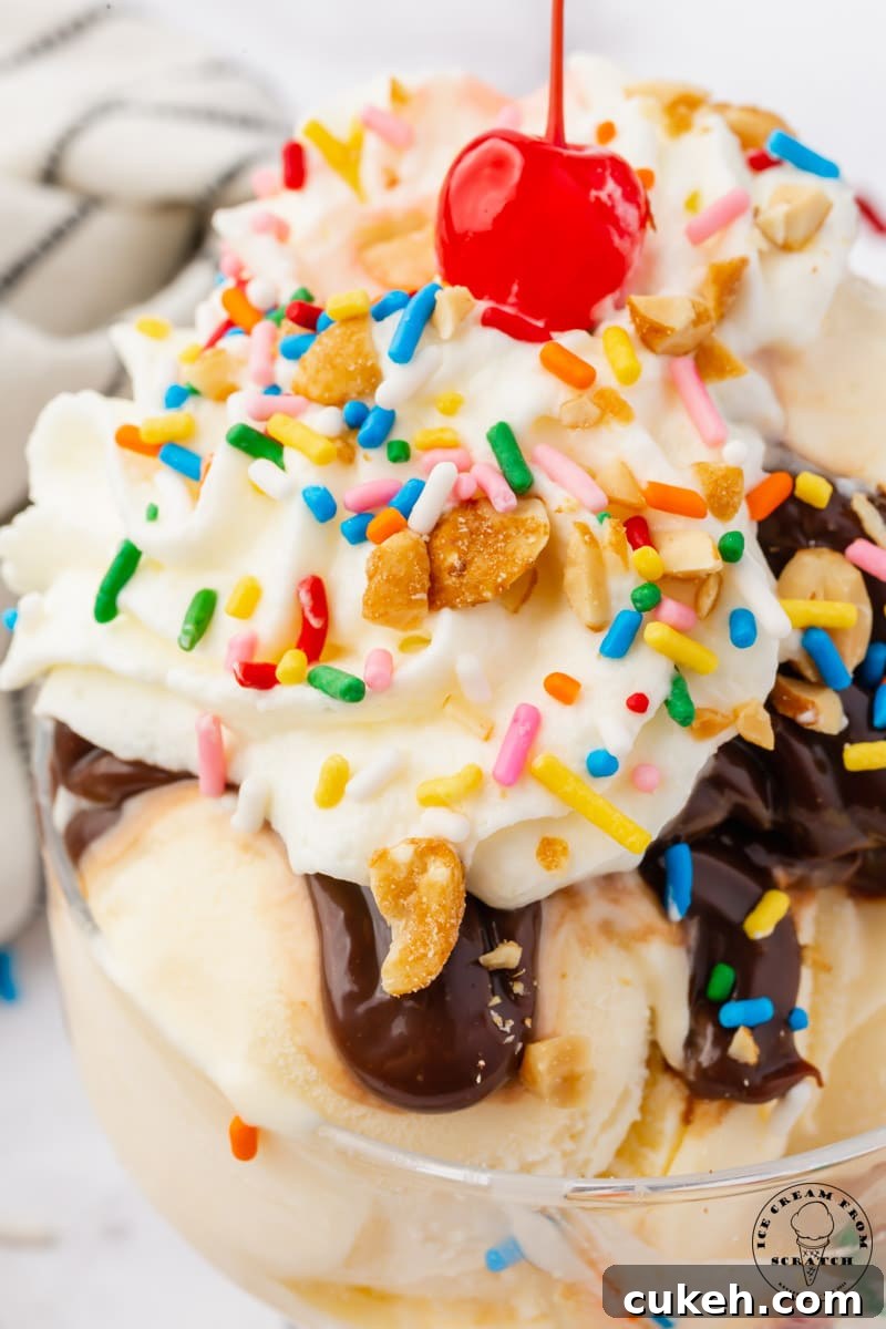 Decadent Hot Fudge Sundae Recipe — Rich Chocolate & Vanilla Scoop 7 closeup view of a classic hot fudge sundae with a cherry on top.