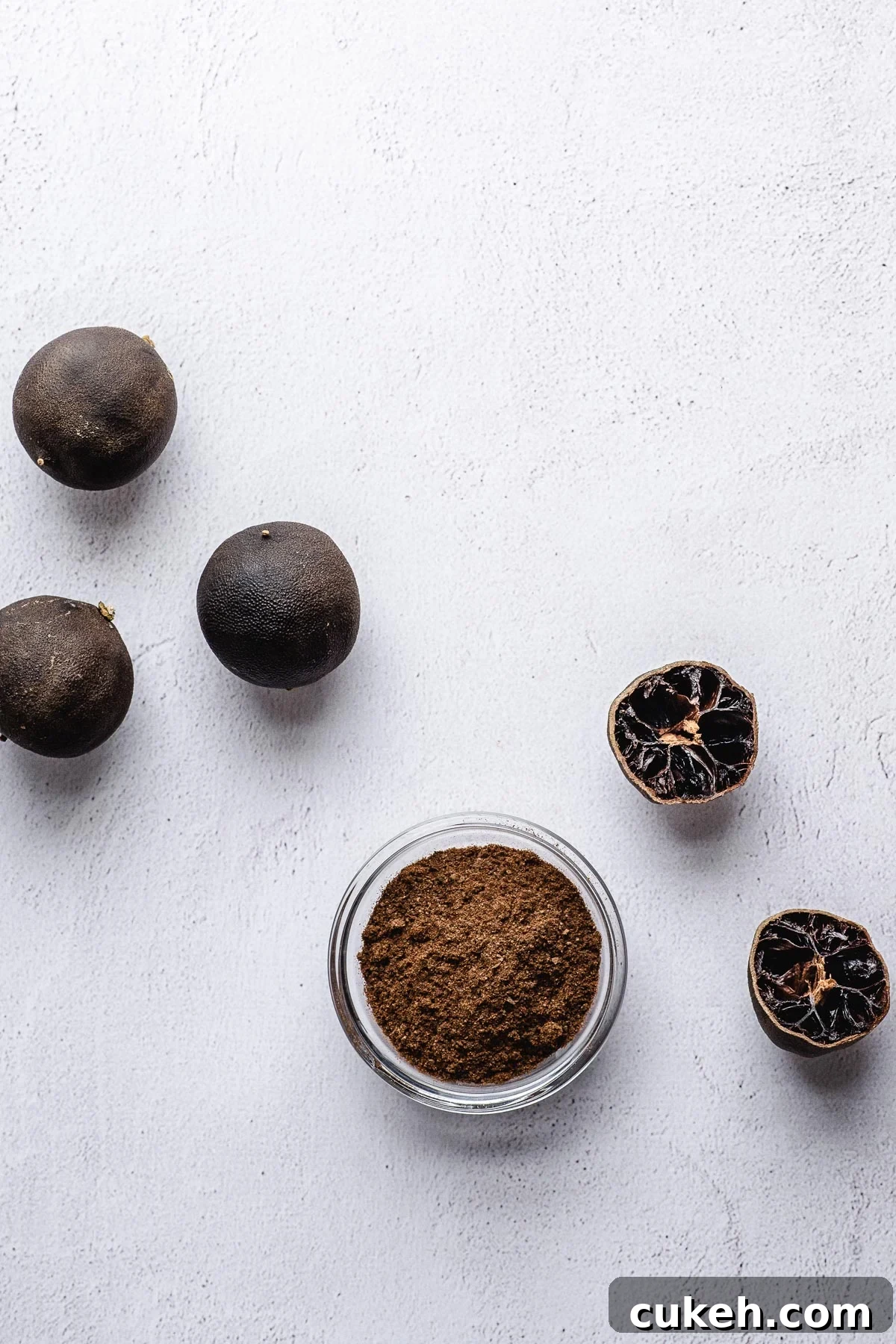 Black limes are ground with a spice grinder to form a dark brown dried lime powder.