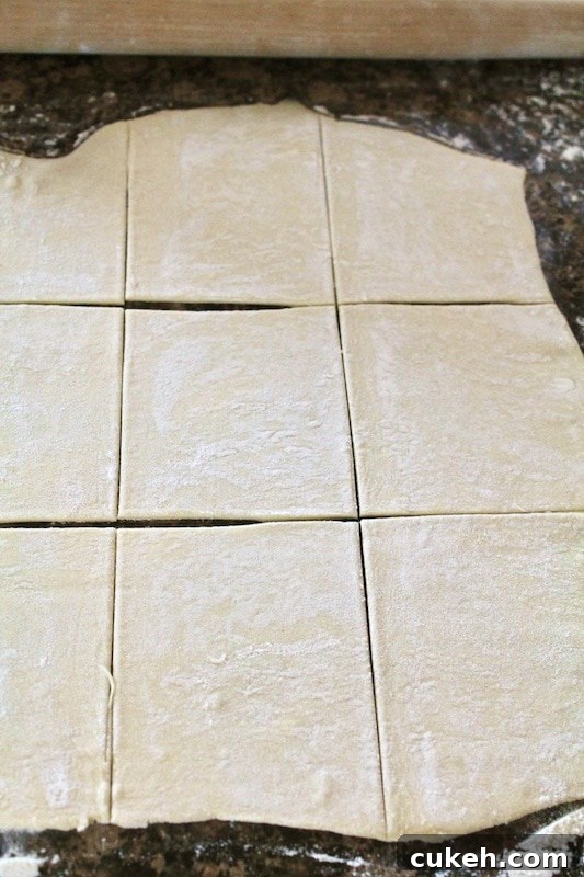 top each puff pastry square with apple filling