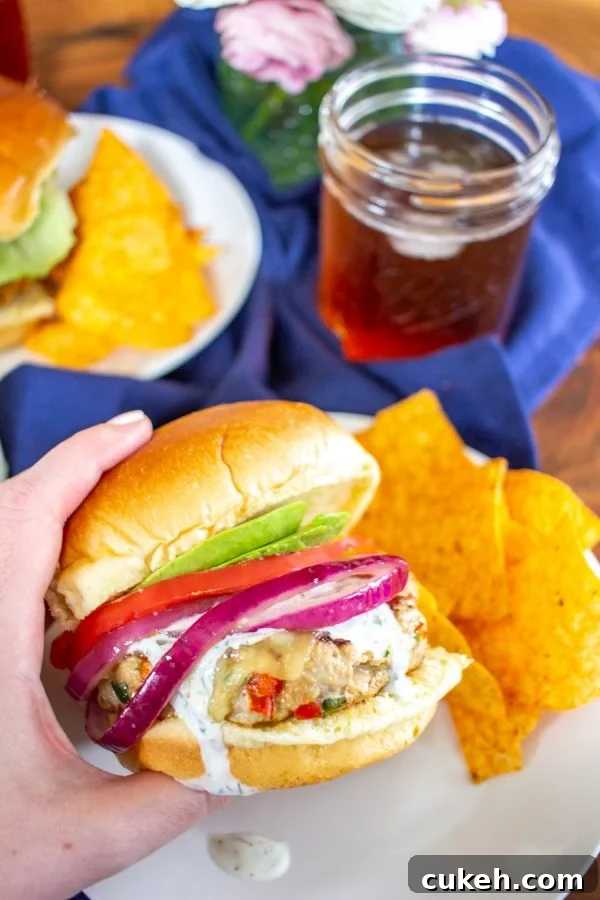 These Southwest Turkey Burgers are loaded with chopped bell pepper, poblano pepper, onion, garlic, and spices so that they are bursting with flavor. These Southwest Turkey Burgers are an easy to make healthy alternative to a beef burger.
