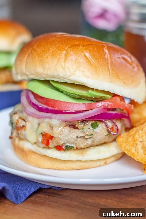 These Southwest Turkey Burgers are loaded with chopped bell pepper, poblano pepper, onion, garlic, and spices so that they are bursting with flavor. These Southwest Turkey Burgers are an easy to make healthy alternative to a beef burger.