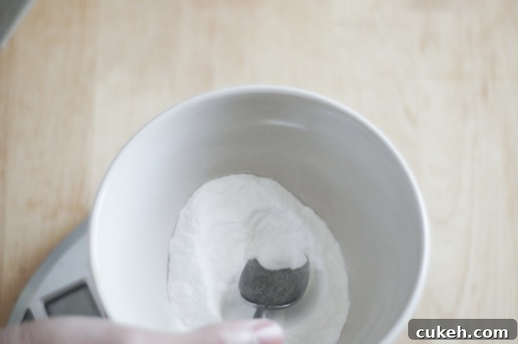 Cinnamon Sugar Soft Pretzels: Fluffy Homemade Recipe 4 Measuring baking soda in a scale