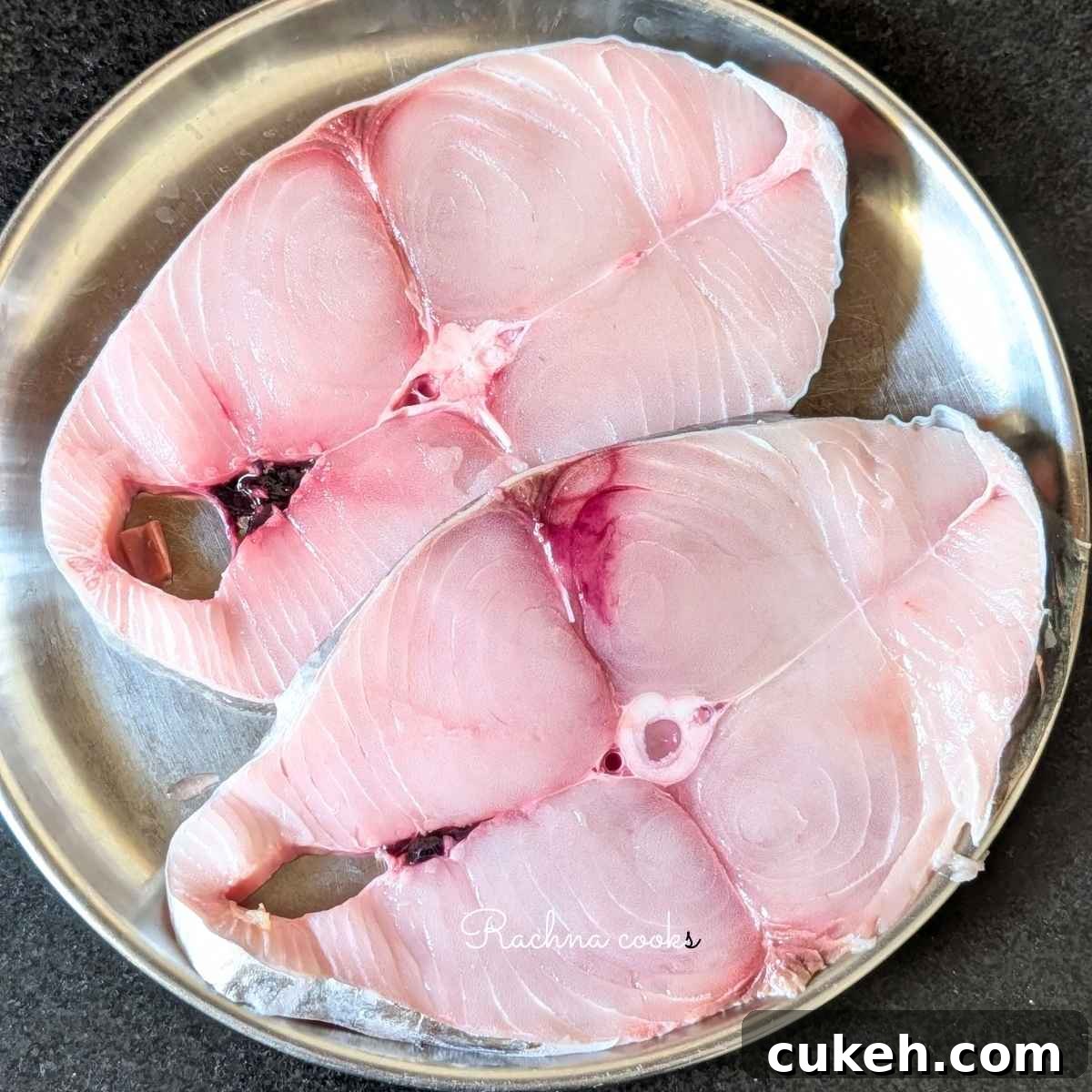 Two large surmai fillets in a plate