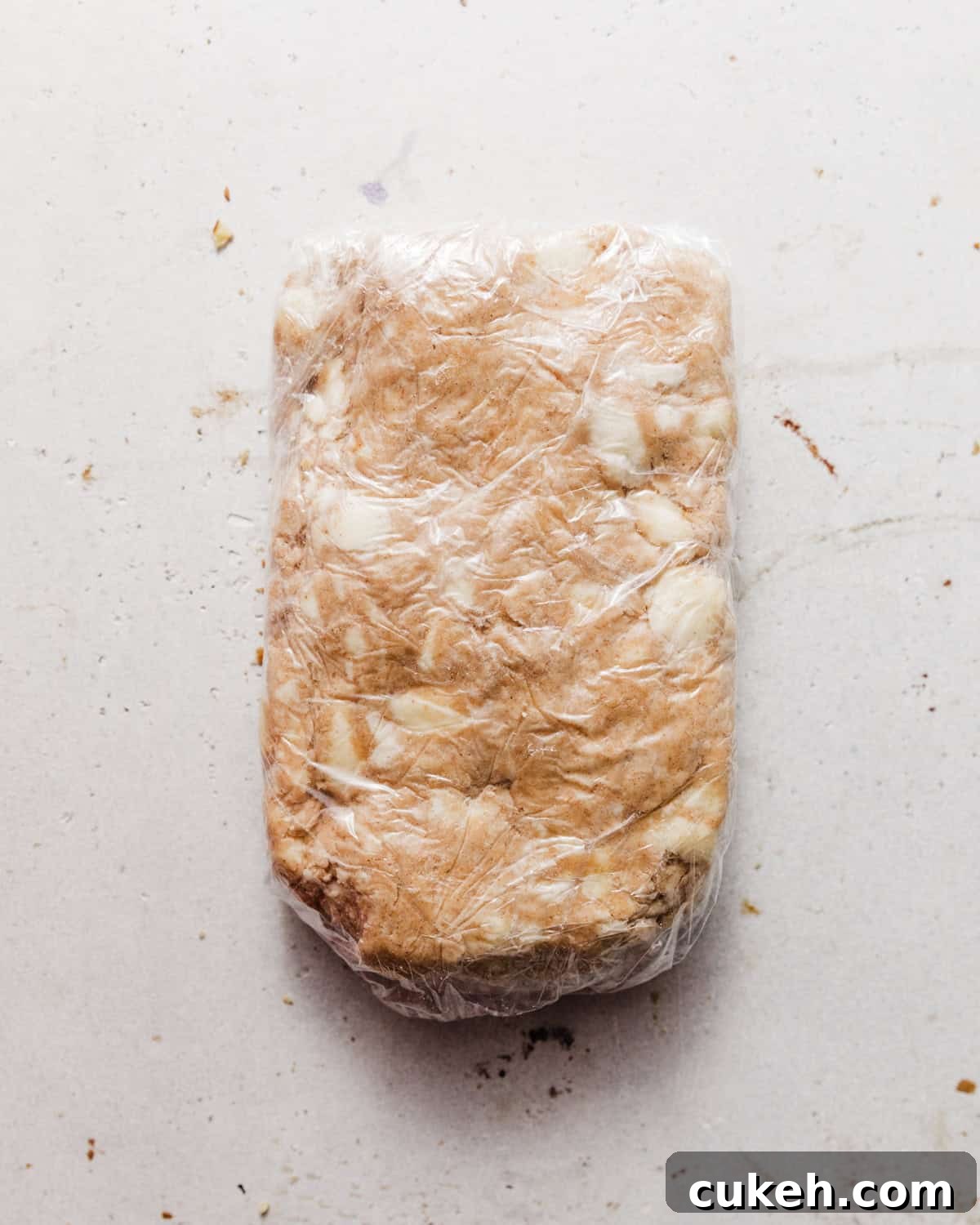 pie crust wrapped in plastic wrap.