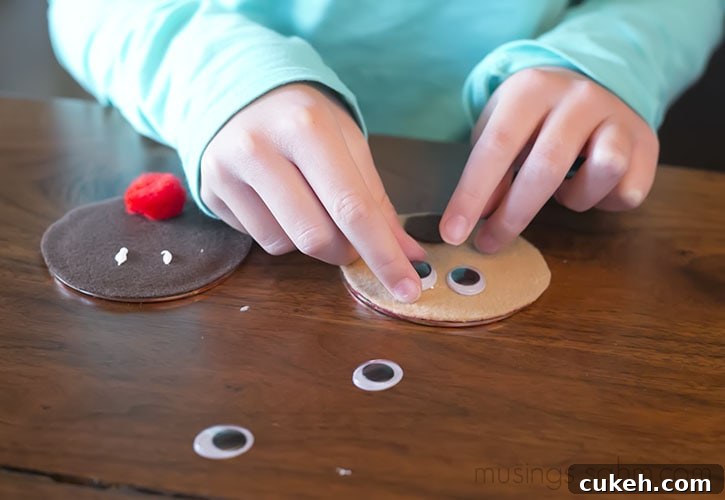 Glue eyes to the reindeer faces