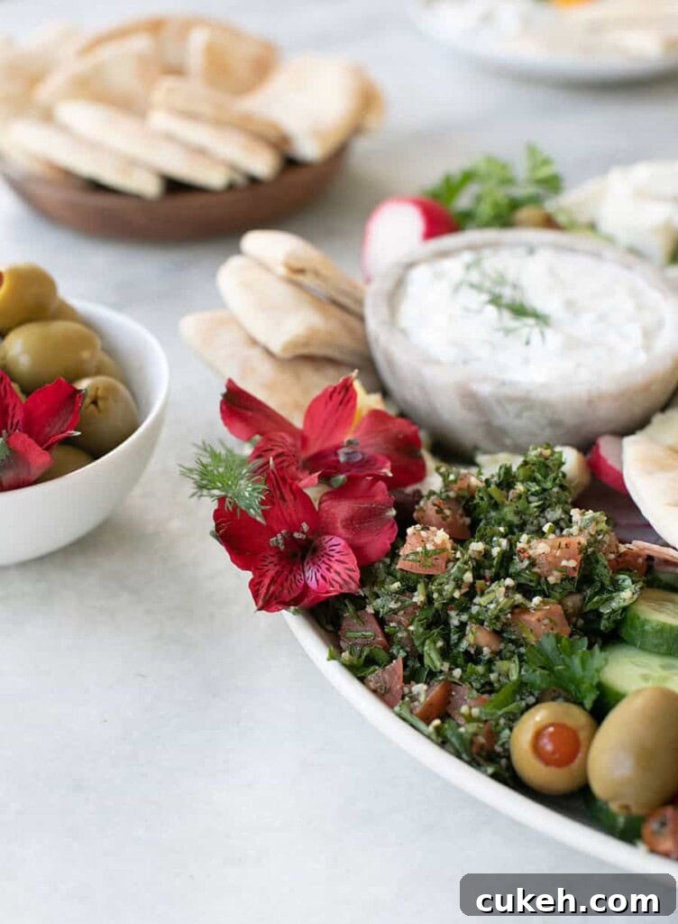 Authentic Greek Mezze Platter: Meze Recipes & Serving Guide 7 Mezze platter with olives, dips and bread.