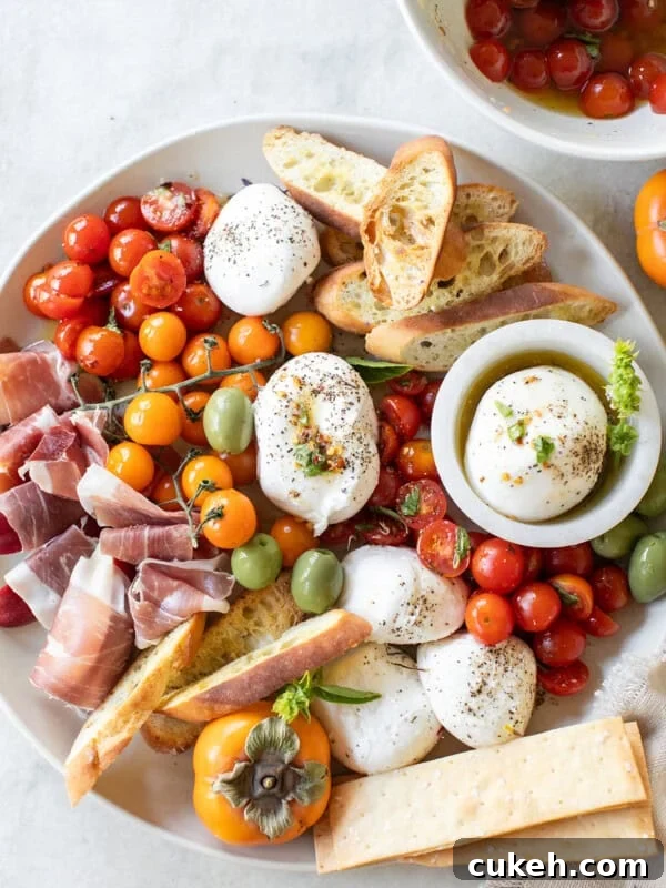 Burrata Platter with marinated tomatoes, crackers, olives and crostini.