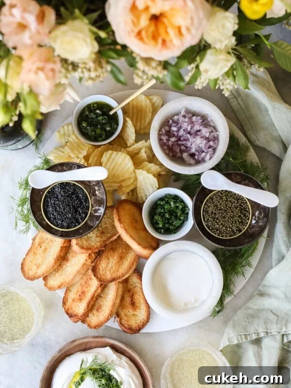 Caviar appetizer with chips, bread, onions, dip and sparkling wine.
