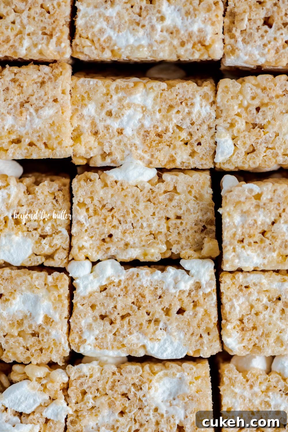 Overhead closeup image of the best rice krispie treats stacked and on their side | All Images © Beyond the Butter™