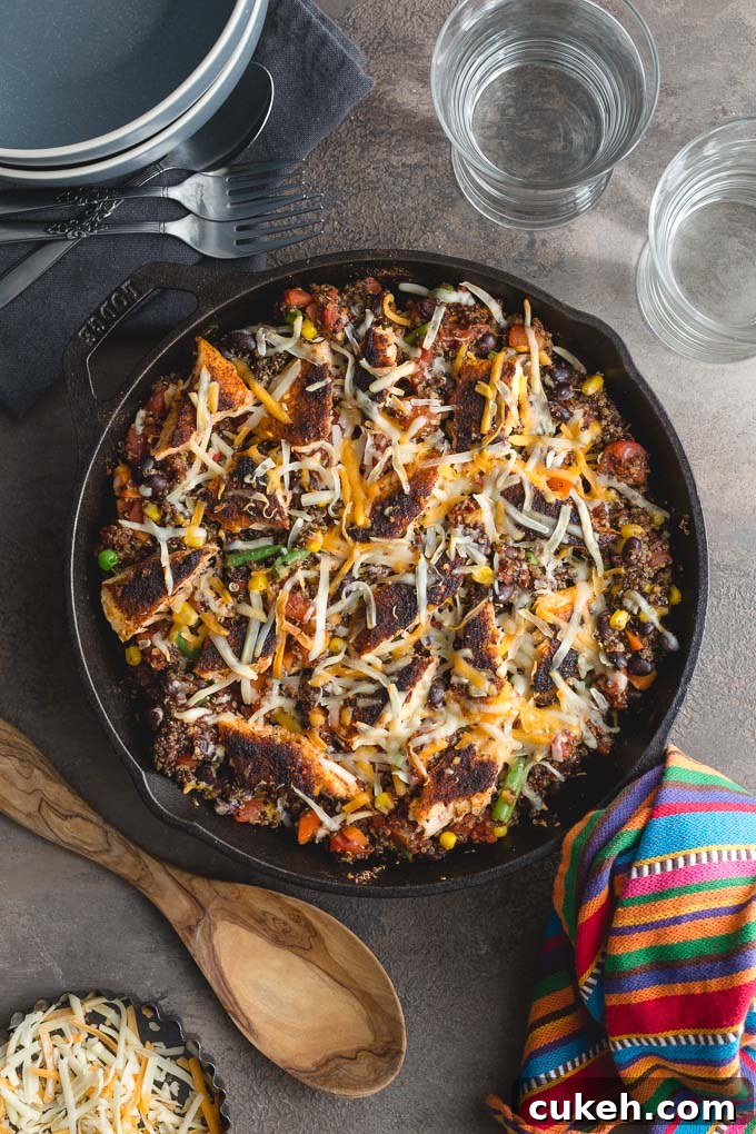 Overhead view of salmon quinoa bake in a cast iron pan.