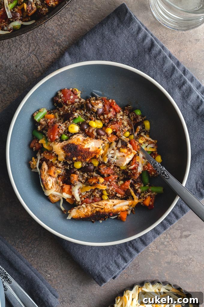 Salmon quinoa casserole served up in a blue bowl.
