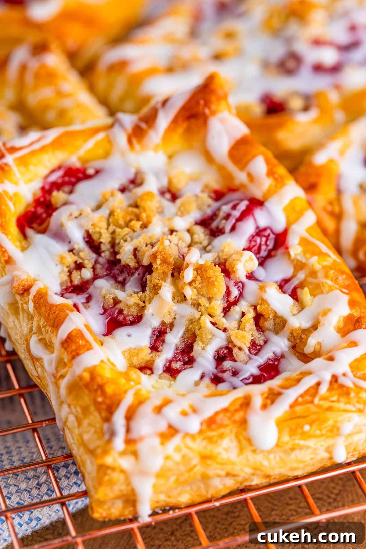 Cherry Danish with Cream Cheese: Flaky Pastry Recipe 3 Close up of one Cherry Danish showing filling and topping.