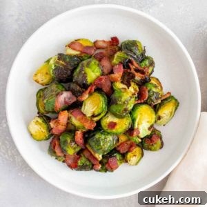 A plate of air fryer brussels sprouts with bacon.