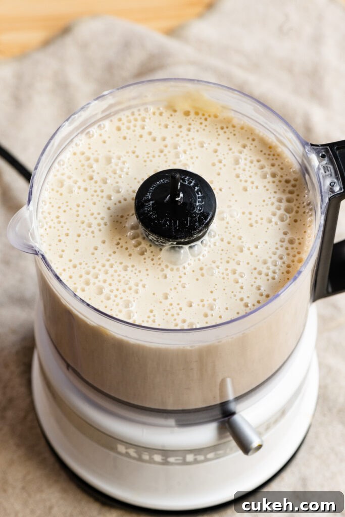 Liquid banana cake batter in a food processor.