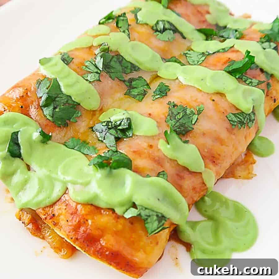 Easy Baked Red Chicken Enchiladas (with Creamy Avocado Sauce Drizzle)