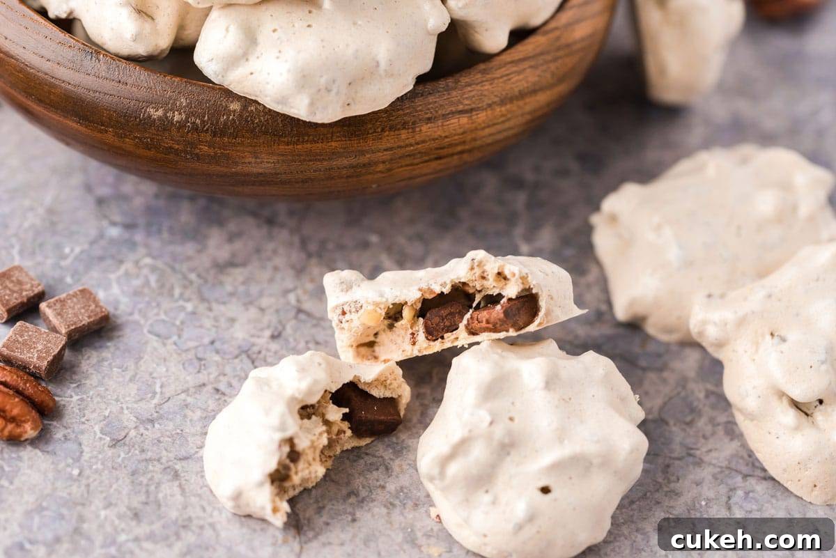 Chocolate chip meringue cookies. A chocolate chip meringue cookie split in half.