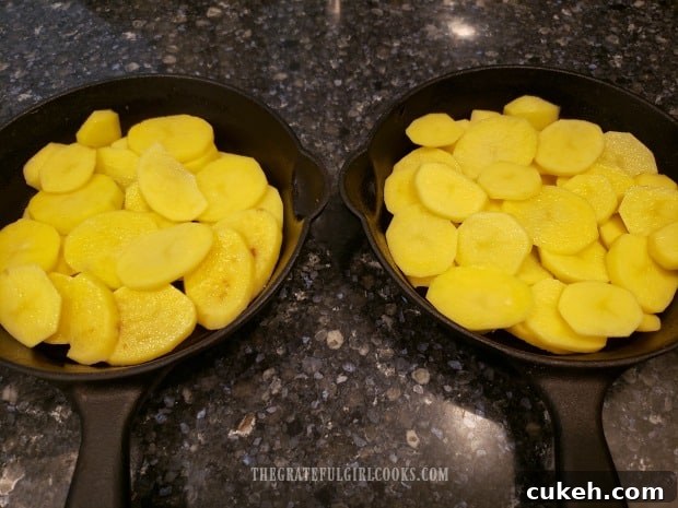 Peeled, thinly sliced potatoes are fanned out in baking skillets or pans. Peeled, thinly sliced potatoes are fanned out in baking skillets or pans.