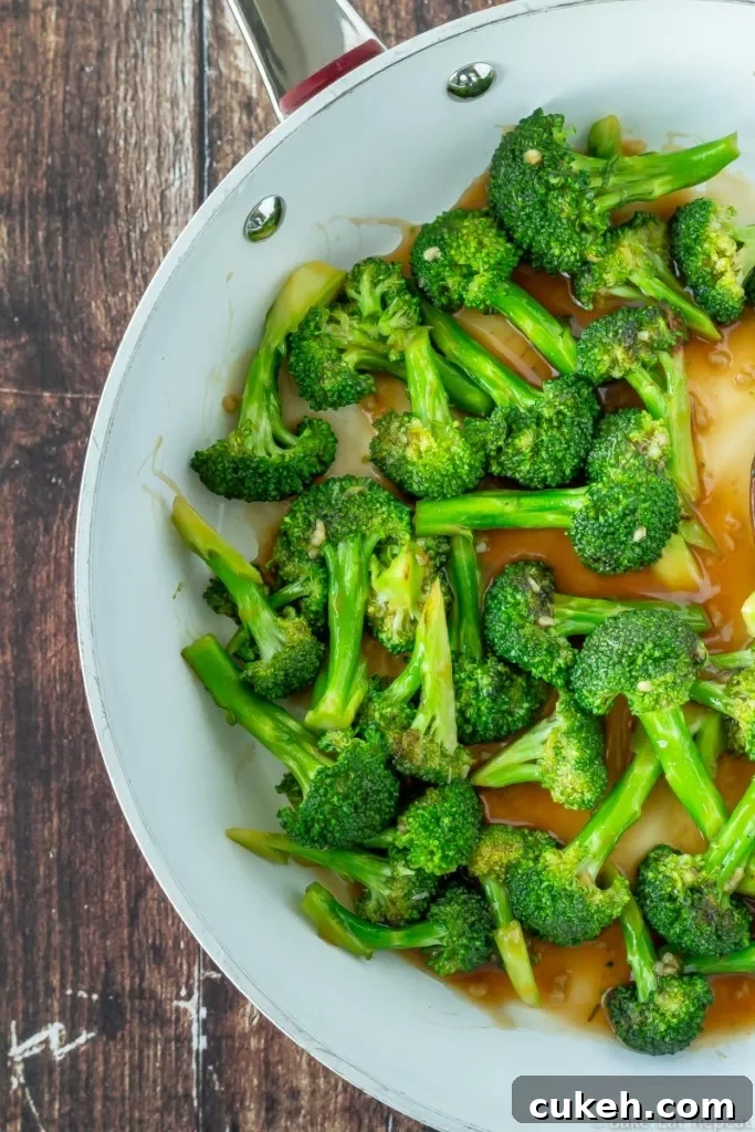 Broccoli stir fry in an easy Asian sauce in a skillet.