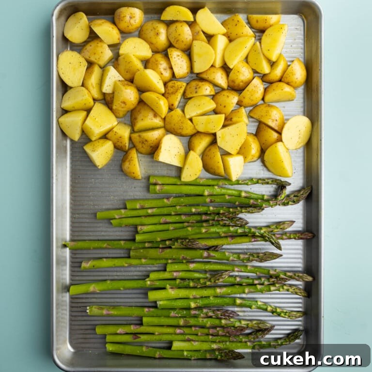Potatoes and asparagus ready to roast