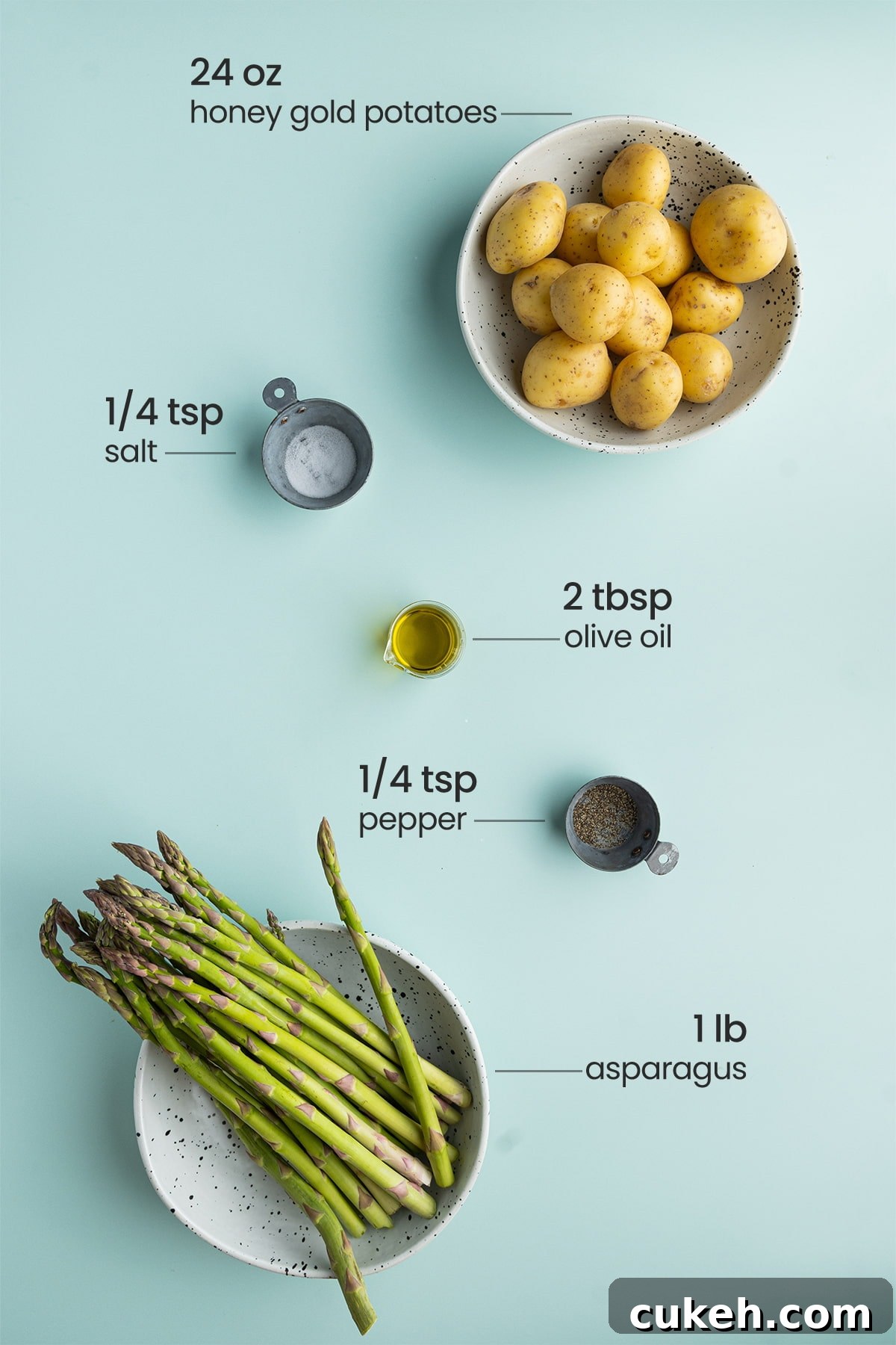 all ingredients for roasted potatoes and asparagus - honey gold potatoes, salt, olive oil, pepper, asparagus