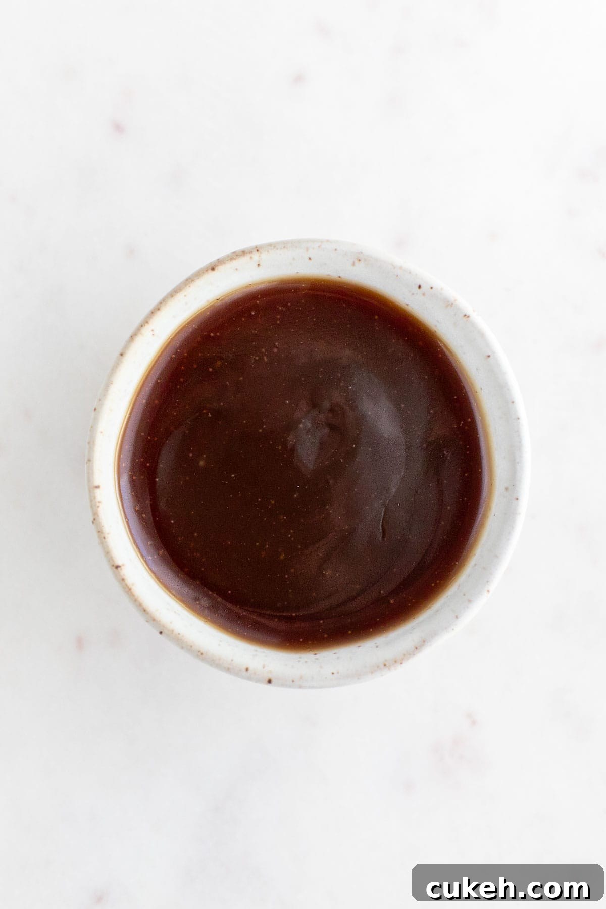 Small bowl with vegan caramel sauce.