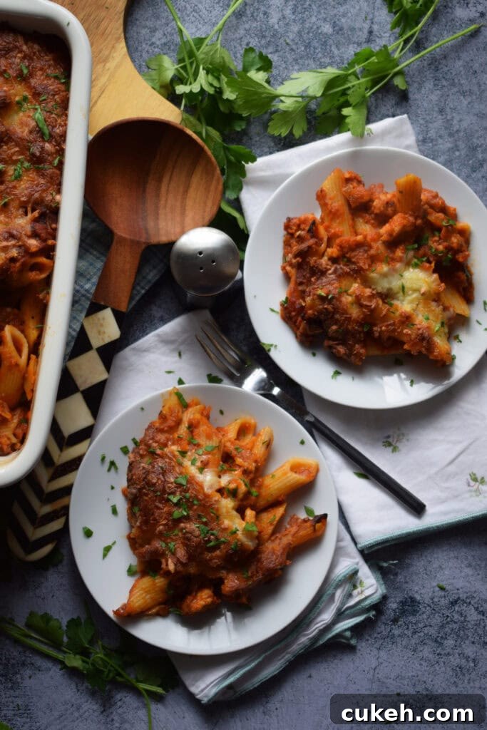 Pasta dishes on white plates.