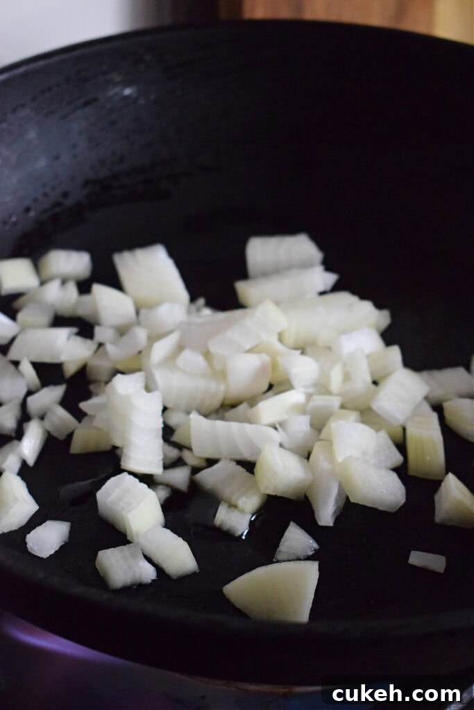 Cooking onions in a skillet.
