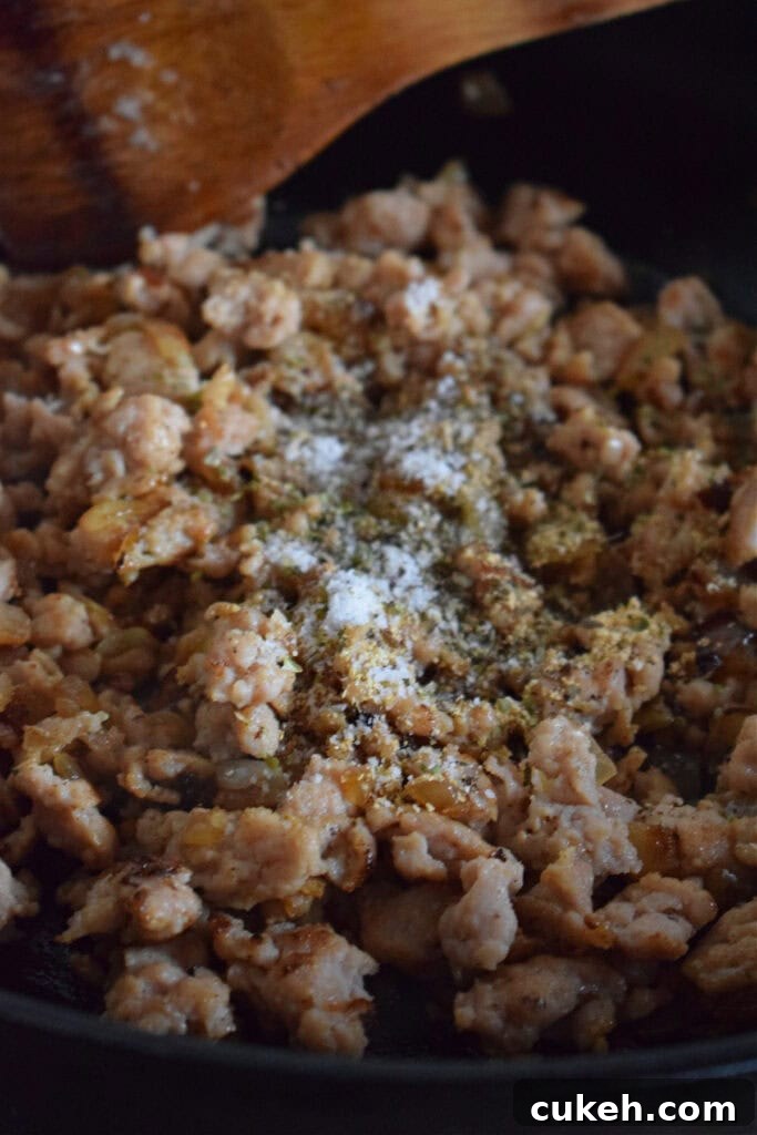 Add seasonings to the ground turkey.