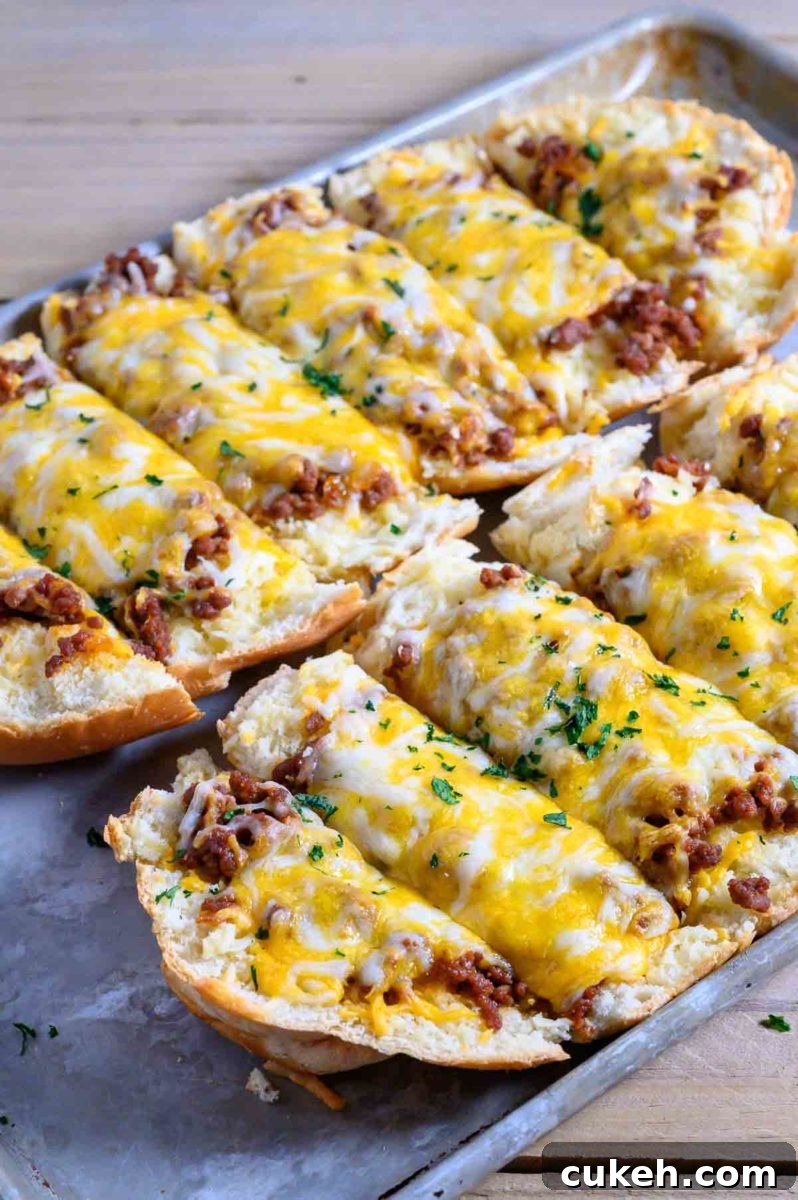 Ground Beef and Garlic Bread Recipe on a baking sheet.