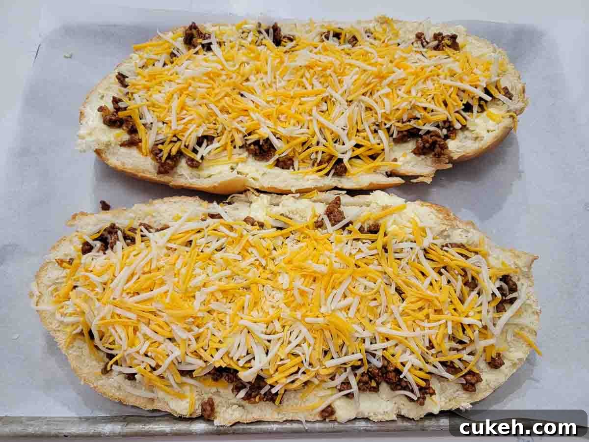 sloppy joe meat and shredded cheese layered on garlic bread.