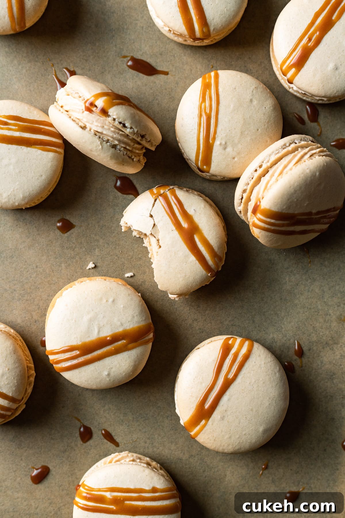 Caramel macarons drizzled with caramel sauce.