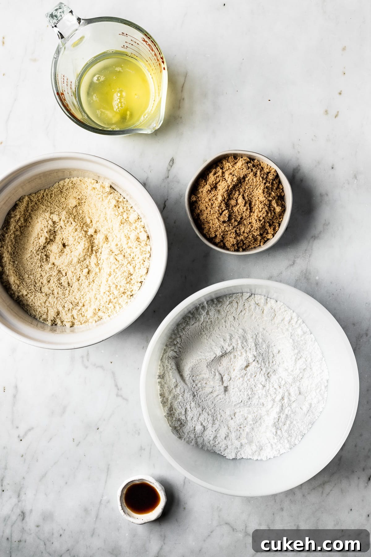 Ingredients for macarons in bowls.