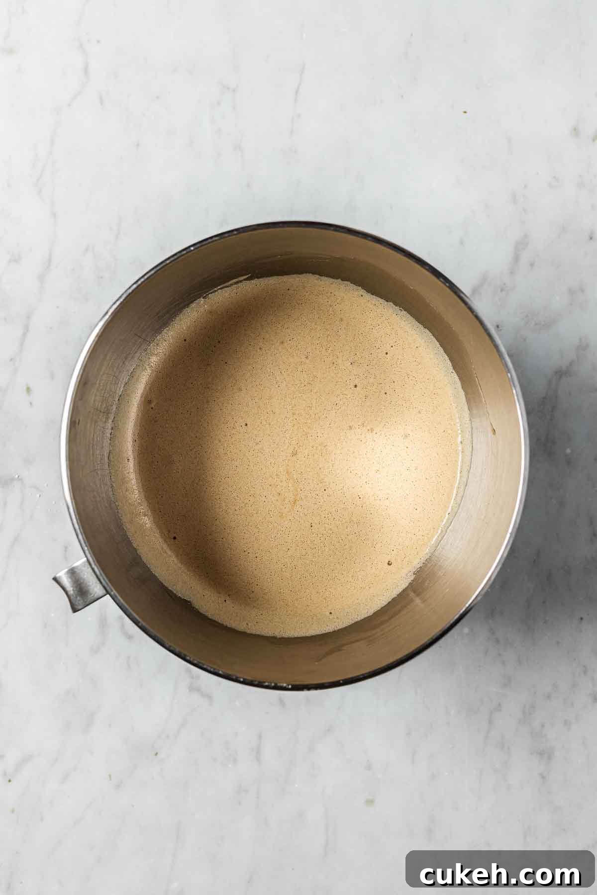 Brown sugar and egg whites in a mixing bowl.