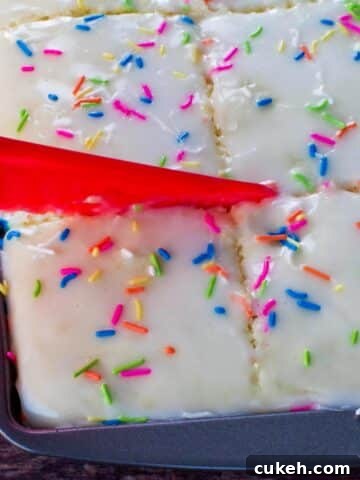 Sugar cookie sheet pan pancakes being cut into with a nylon knife