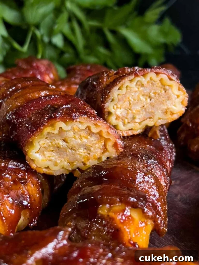 Smoked Shotgun Shells: Savory Sausage-Stuffed Appetizer Recipe 11 Smoked shotgun shells on a cutting board with one cut in half so you can see the cross section.