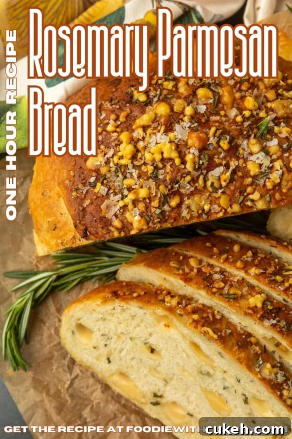 partially sliced one hour rosemary parmesan bread on parchment paper with text describing the photo over it