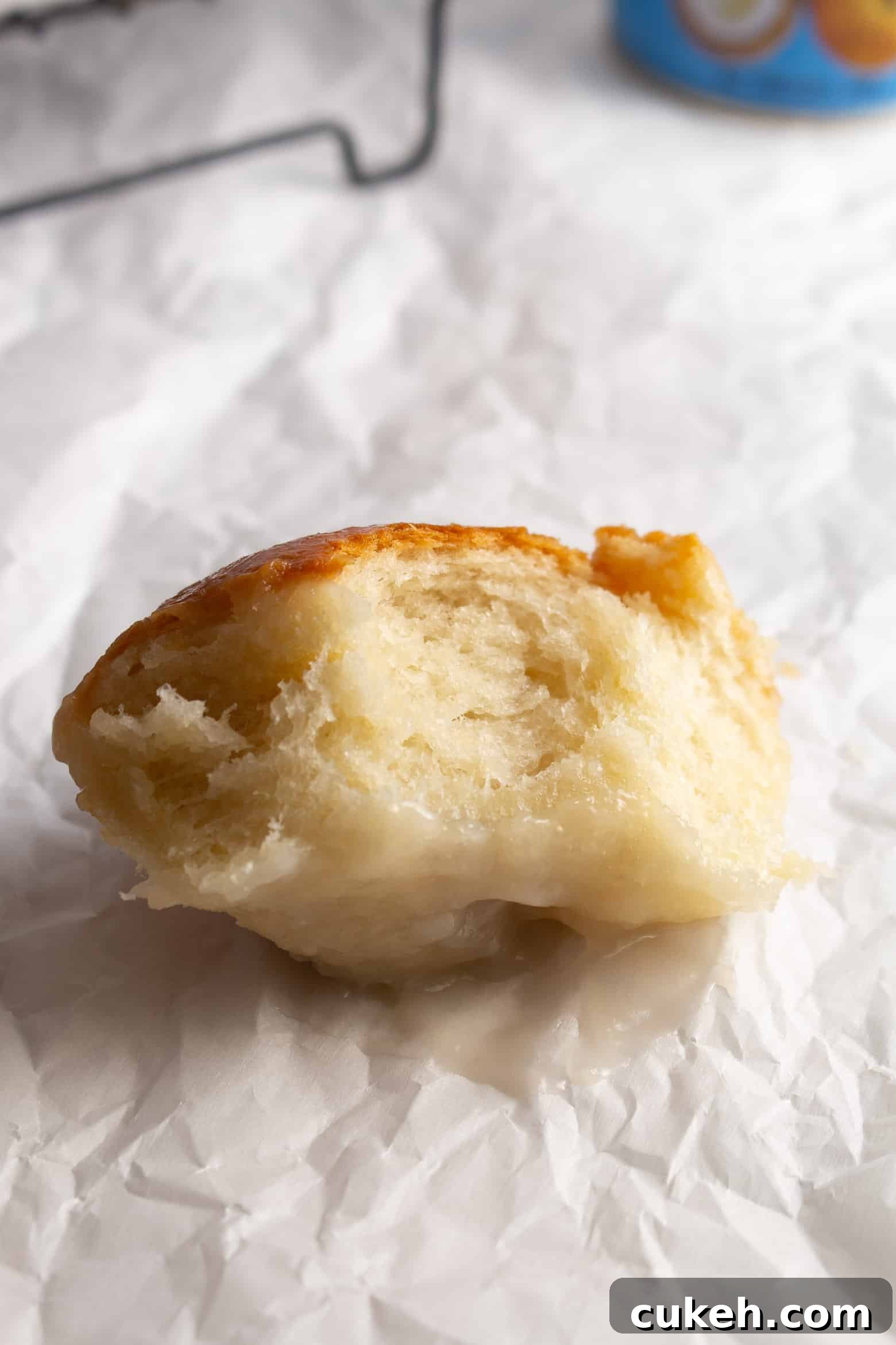 A bitten dinner roll.