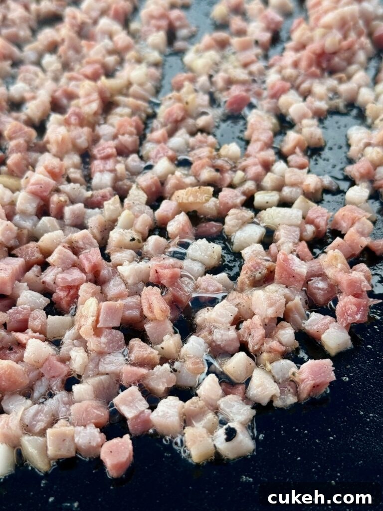 Mediterranean Breakfast Sandwiches on the Blackstone Grill 3 pancetta cooking on griddle