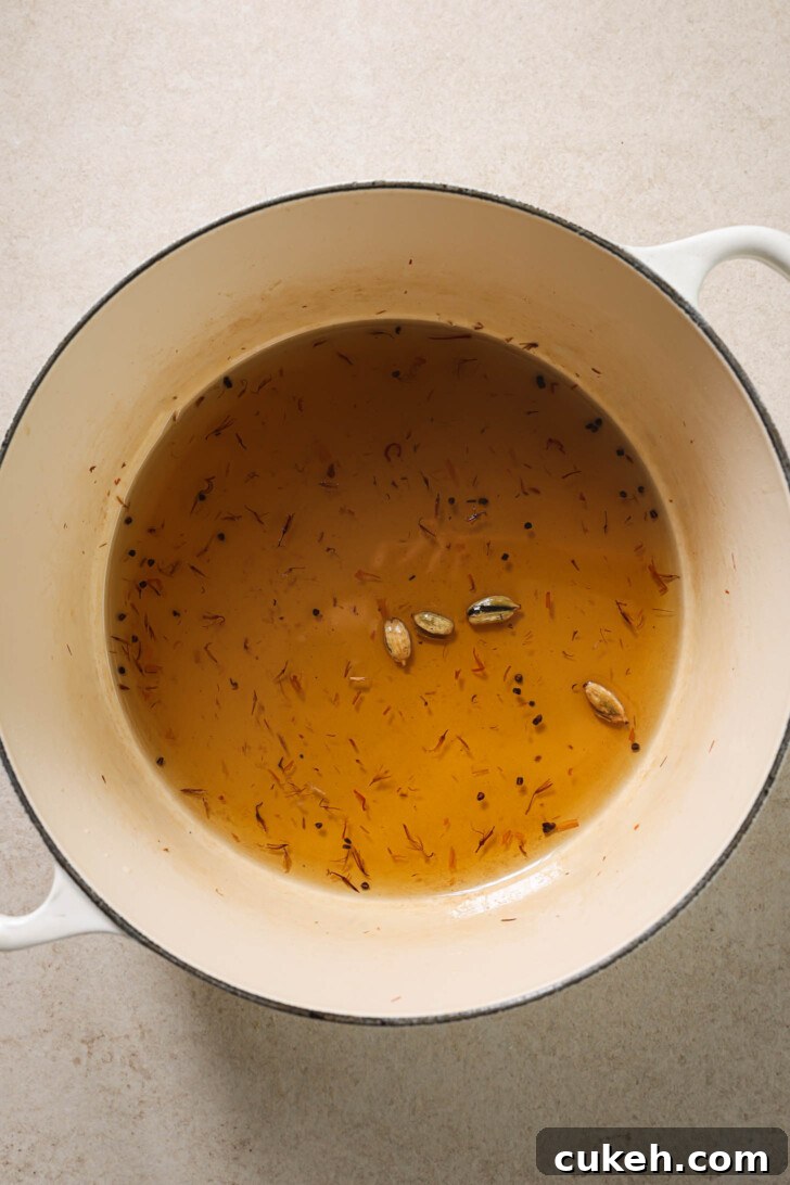 Sugar syrup ready in a pot for Gulab Jamun.