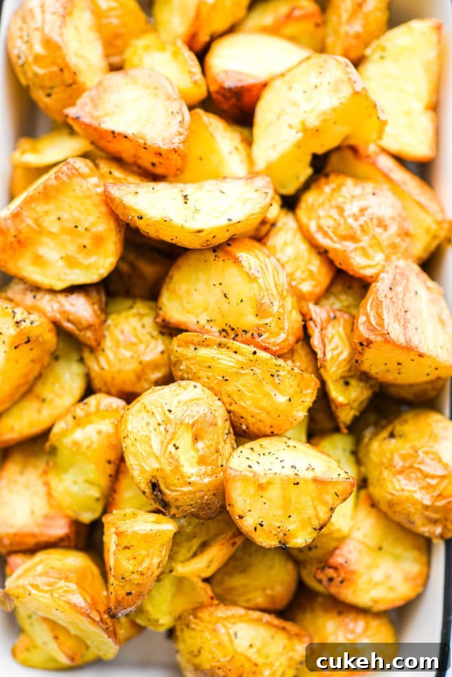 a close up of a small baking dish filled with crispy roasted potatoes